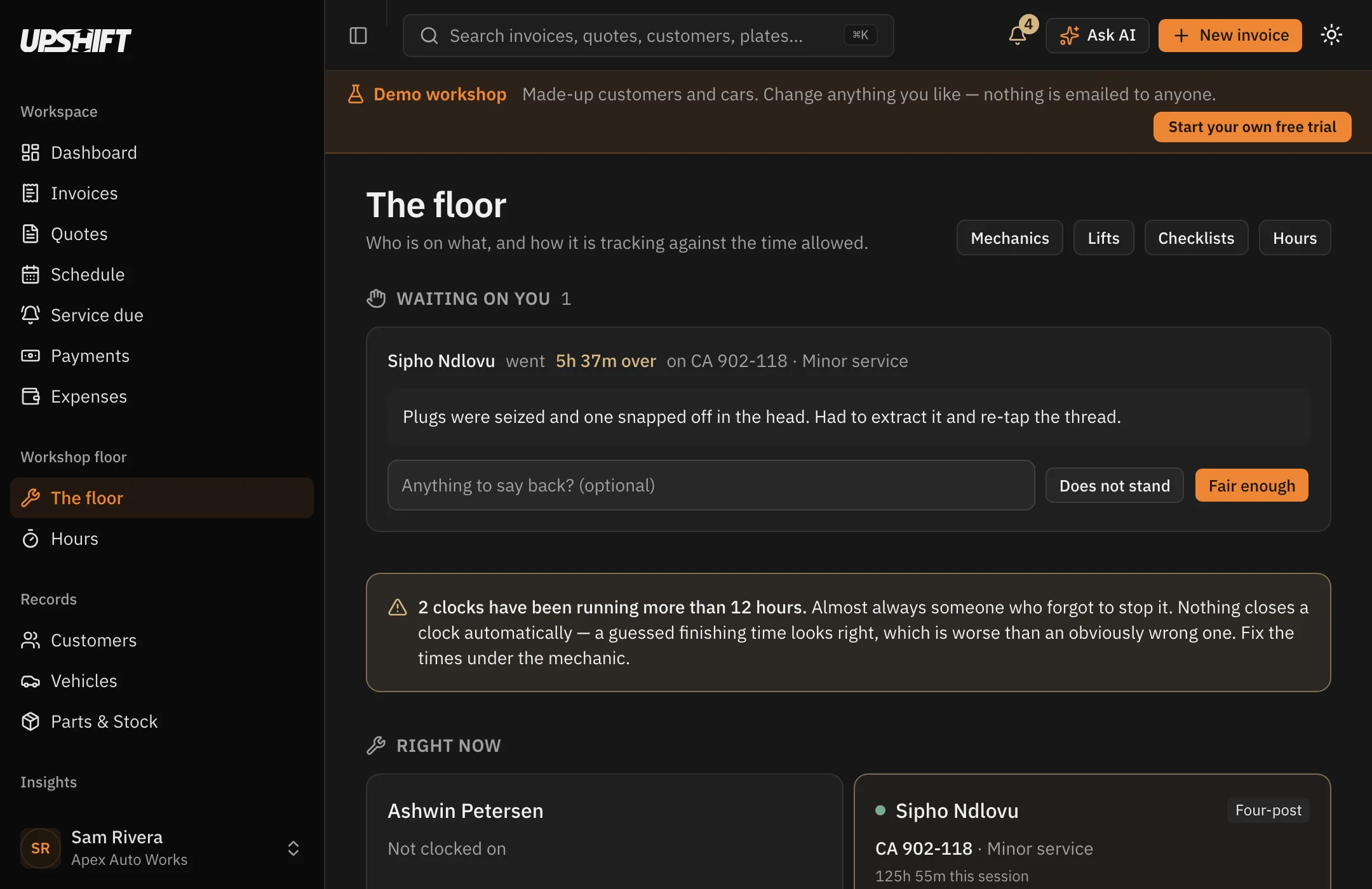 The Upshift floor board: each mechanic with the vehicle they are working on, the lift it is on, and time spent against time allowed.